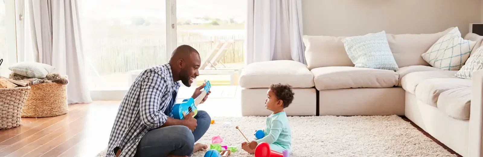 father and baby in a living room