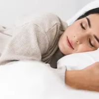 woman sleeping peacefully in bed bug free bed